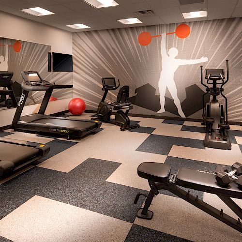 The image shows a modern gym with treadmills, exercise bikes, a bench, dumbbells, a red exercise ball, and vibrant wall art depicting a weightlifter.